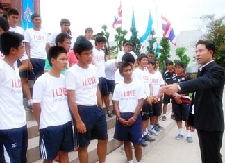 Pattaya City Mayor and United advisor Itthipol Kunplume gives a rousing speech to the junior Dolphins outside City Hall in the build-up to Coke Cup youth football tournament.